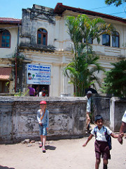 T in front of the Montessori pre-school in Negombo