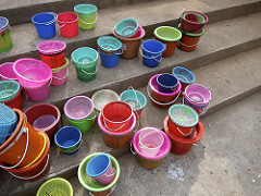 colored buckets with fish for ceremony